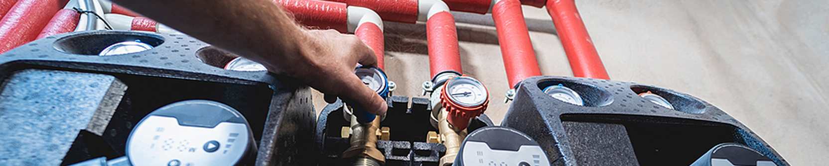 An image of pipes with gauges